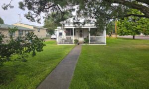 Welcoming One-Story with Covered Porch, Detached Garage & Basement!